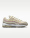 inside profile of the Nike Air Max 95 G Golf Shoes with beige yellow and pink lines