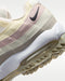 close up of the heel of the Nike Air Max 95 G Golf Shoes and logo, in beige and white