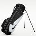 black and white Nike Air Max Lite Golf Stand Bag on its stand