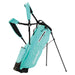 Turquoise golf bag with stand on a white background