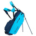 Blue and navy golf bag with stand on a white background