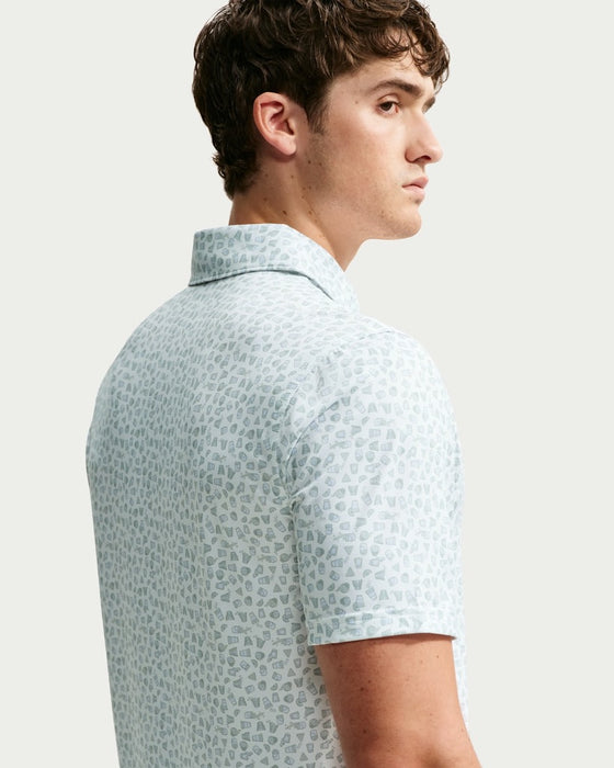 Nike Dri-FIT Micro-Print Golf Polo Shirt in white and green close up of male model