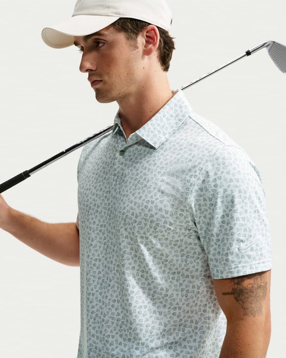 golf holding a club wearing Nike Dri-FIT Micro-Print Golf Polo Shirt in white and green