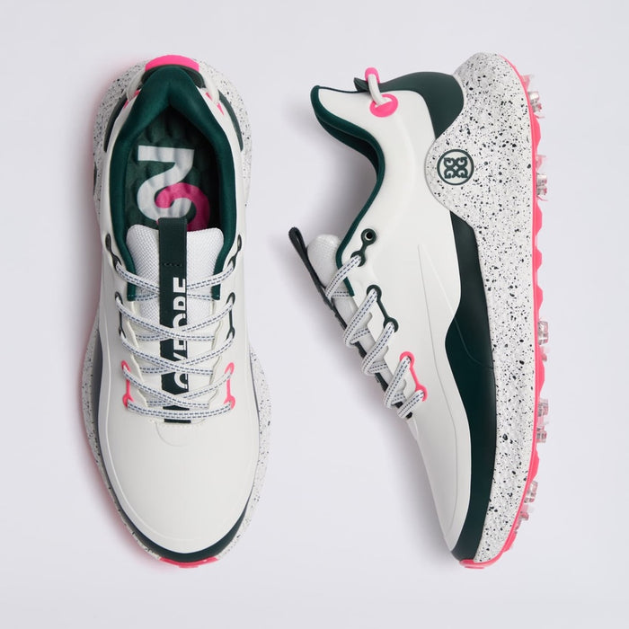 A pair of G/FORE MG4+ O2 G/LOCK Perforated Men's Golf Shoes shown from top and side views on a light grey background. The shoes are primarily white with dark green panels, a speckled white midsole, white laces, and bright pink accents on the tongue, collar, and outsole.