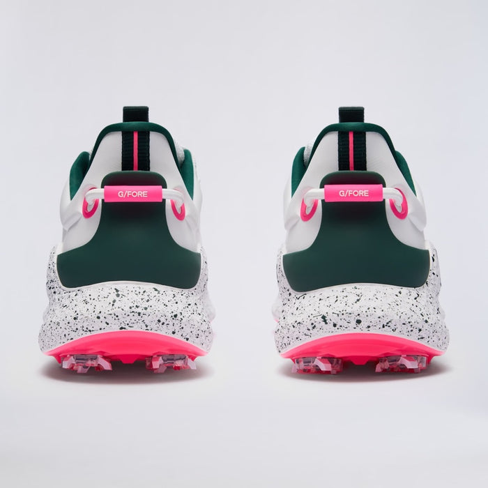 A pair of G/FORE MG4+ O2 G/LOCK Perforated Men's Golf Shoes shown from the back, featuring a white and dark green upper with a speckled white midsole and bright pink accents.