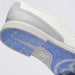 Close-up of a G/FORE Gallivanter Leather Brogue Men's Spikeless Golf Shoes sole showing a white leather upper with perforations, a white midsole, and a blue translucent golf sole with a visible Gfore logo.