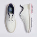 A pair of white G/FORE Gallivan2R Brogue Saddle Men's Golf Shoes shown from the top and side views on a light grey background. The shoes feature navy blue lining, white laces, and pink and silver golf club spikes on the sole.