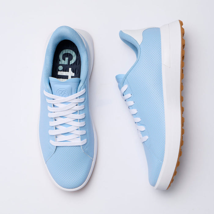 A pair of light blue G/FORE G.112 Perforated Men's Spikeless Golf Shoes shown from top and side angles on a clean white background. The shoes feature white laces, white midsoles, and brown outsoles, with the brand name G.112 visible on the inner sole.