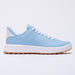 A light blue G/FORE G.112 Perforated Men's Spikeless Golf Shoes with white laces, a thick white midsole, and a gum brown outsole, shown in a side profile on a white background.