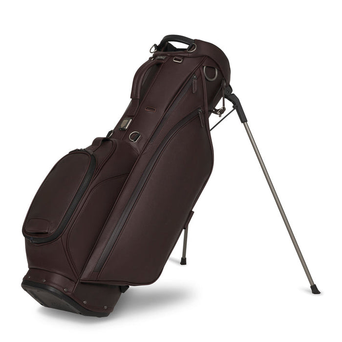 A burgundy/merlot leather Titleist LINKSLEGEND Classic Members II Golf Stand Bag with black trim and silver metal legs, shown on a clean white background.