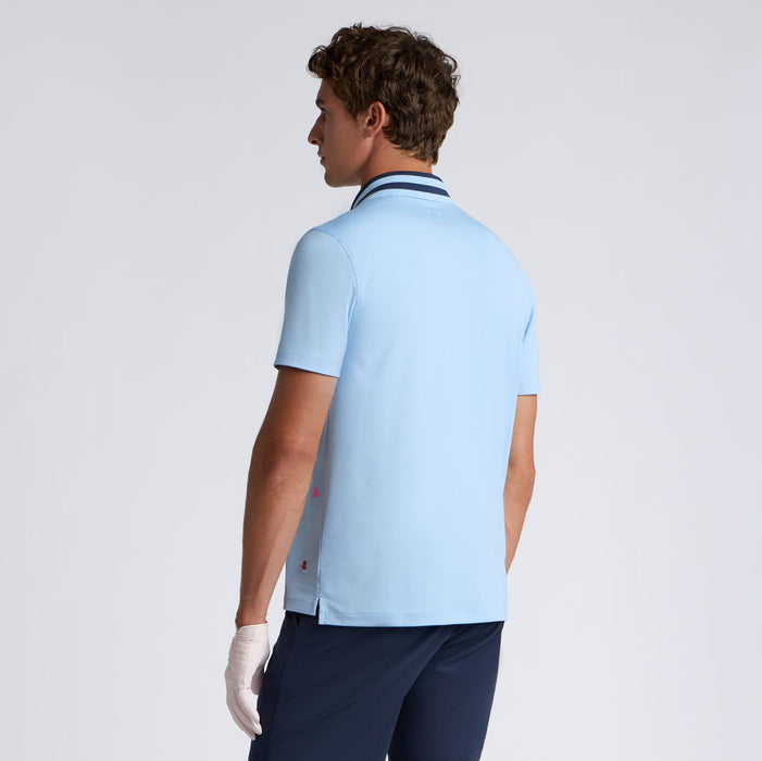back of the G/FORE Embroidered Tech Jersey Men's Golf Polo Shirt on male model. light blue shirt with navy colour