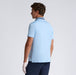 back of the G/FORE Embroidered Tech Jersey Men's Golf Polo Shirt on male model. light blue shirt with navy colour