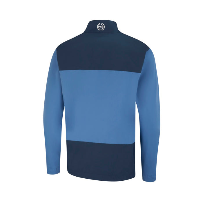 Back view of a PING AquaDrive men's waterproof golf jacket in navy and blue colour-blocked design with a high collar.