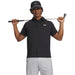Under Armour Playoff 3.0 Printed Polo Golf Shirt in black with white all over pattern on model
