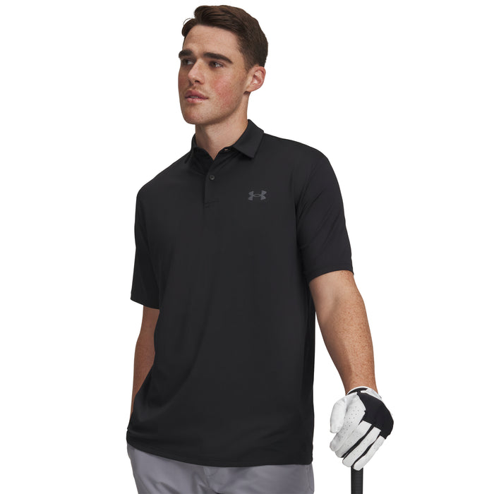 Man wearing a black Under Armour polo shirt holding a golf club on a white background