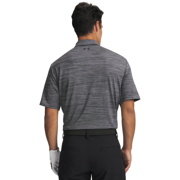 Man wearing a grey Under Armour polo shirt on a white background
