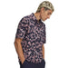 Under Armour Matchplay Printed Polo Golf Shirt in navy and pink floral print on model