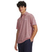 Under Armour Matchplay Printed Polo Golf Shirt in pink crab print on model facing forwards