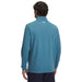 Person wearing a blue under armour golf midlayer with a brand logo on the back, on a white background