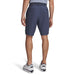 A model wearing Under Armour Drive Golf Shorts  in downpour grey facing away, showing the buttons on the back pockets