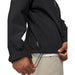 Side view of a black Under Armour Drive Pro waterproof golf jacket showing the adjustable hem drawstring detail.