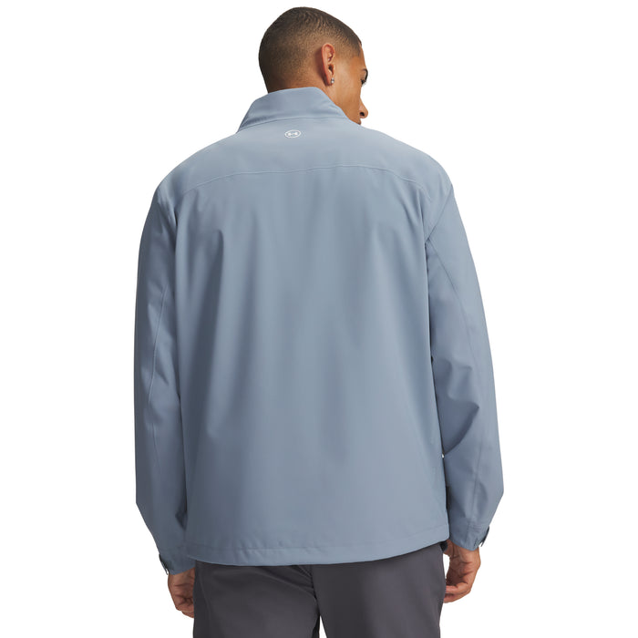 Back view of a light blue Under Armour Drive Pro waterproof golf jacket with a small logo on the collar.