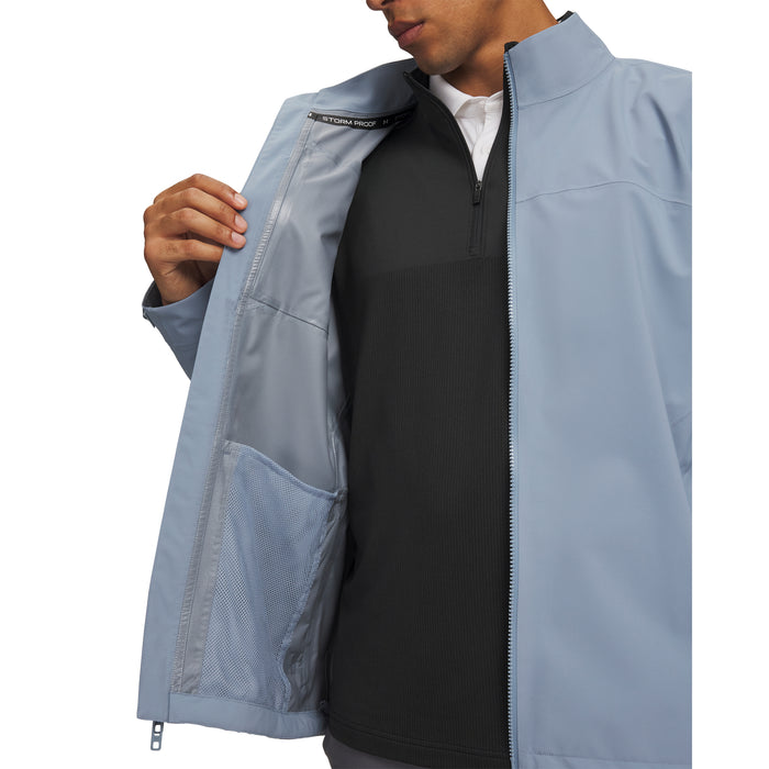 Under Armour Drive Pro waterproof golf jacket in light blue, showing the interior mesh pocket and zip detail.