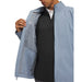 Under Armour Drive Pro waterproof golf jacket in light blue, showing the interior mesh pocket and zip detail.