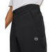 Under Armour Drive Pro waterproof golf trousers in black, featuring a side pocket and white logo detail.