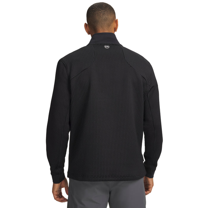 Back view of black Under Armour Drive Pro Hybrid golf midlayer with a textured pattern and small logo at the neck.