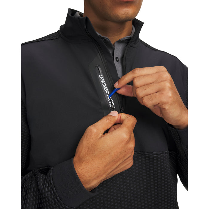 Black Under Armour Drive Pro Hybrid golf midlayer, front view showing half-zip detail and textured fabric panels.
