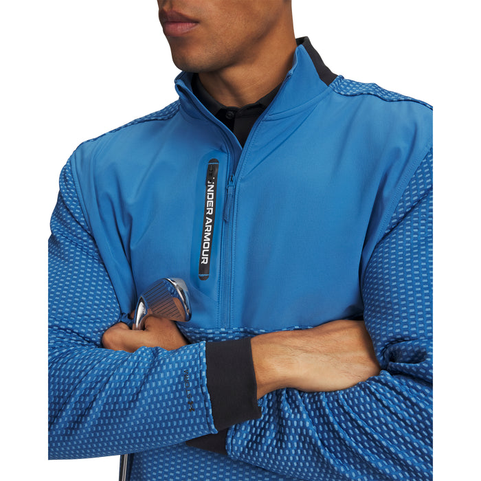 Blue Under Armour Drive Pro Hybrid golf midlayer with half-zip, textured sleeves, and black collar, front view.