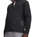 Under Armour Drive Pro Hybrid black full-zip golf jacket with textured shoulder panels and zipped side pocket.