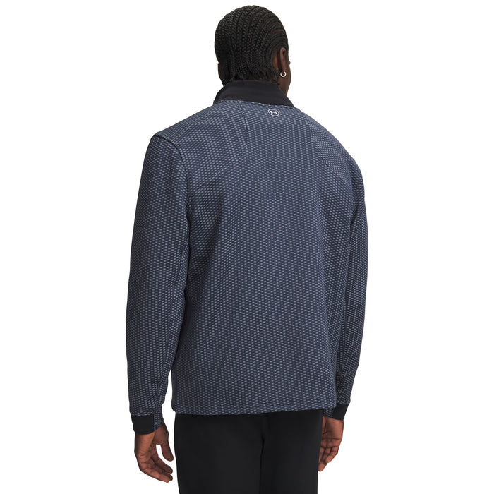 Back view of a navy blue Under Armour Drive Pro Hybrid golf jacket with a textured pattern and black collar.