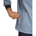 Under Armour Drive Pro Hybrid golf hoodie in blue with a textured pattern, showing a side pocket and black cuff detail.