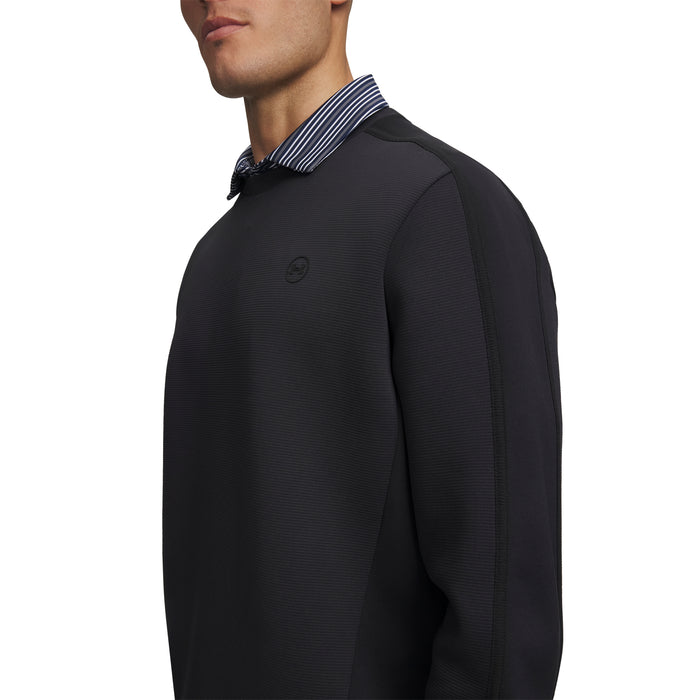 Under Armour Drive men's black crew neck golf midlayer, side view showing textured fabric and subtle chest logo.