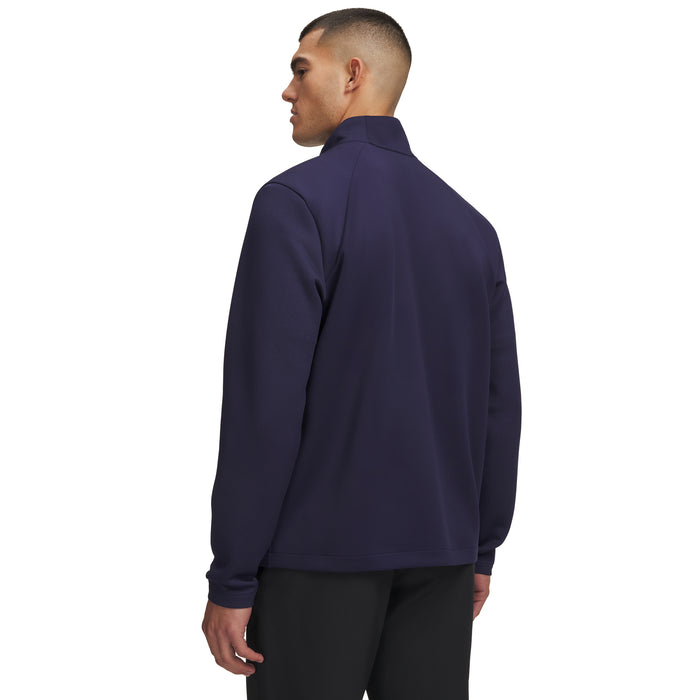 Back view of a navy blue Under Armour Drive men's quarter-zip golf midlayer with a textured fabric finish.