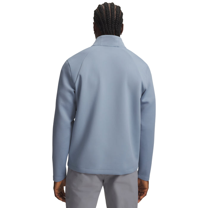 Back view of a light blue Under Armour Drive men's quarter zip golf midlayer with textured sleeves.