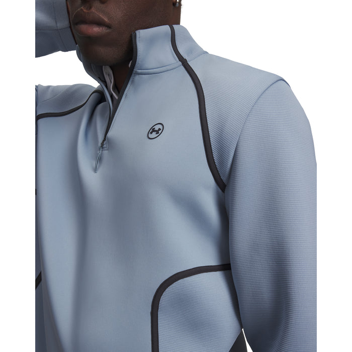 Under Armour Drive men's light blue quarter-zip golf midlayer with black trim and chest logo, close-up front view.