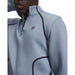 Under Armour Drive men's light blue quarter-zip golf midlayer with black trim and chest logo, close-up front view.