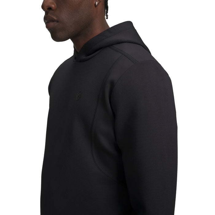 Under Armour Drive men's golf hoodie in black, featuring a textured fabric and a side view of the hood and chest.