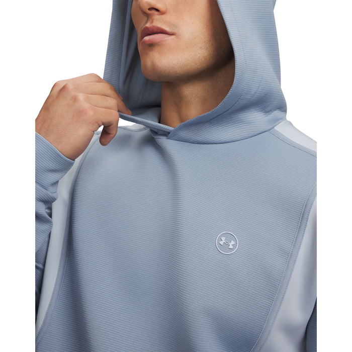 Under Armour Drive men's golf hoodie in light blue with a textured finish and small chest logo, close-up view.