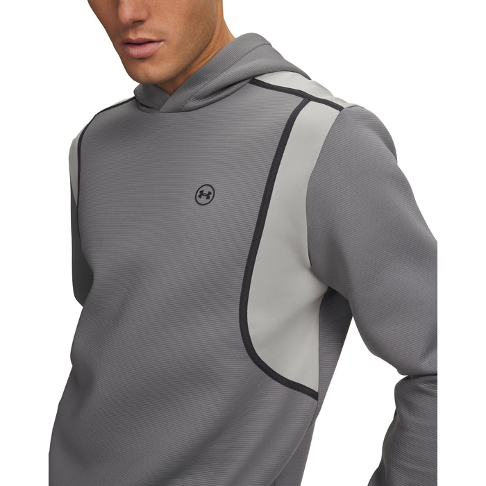 Under Armour Drive men's golf hoodie in grey, featuring a textured fabric, hood, and black logo detail on the chest.