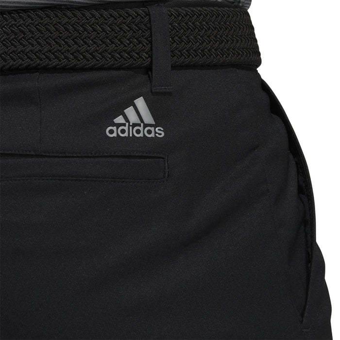 black Adidas golf trousers